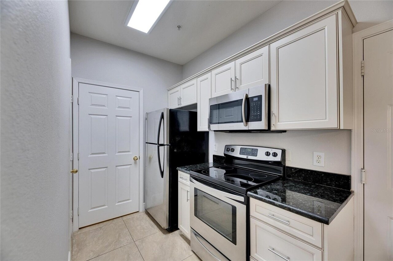 Door to the utility room - 13016 Sanctuary Cove Dr
