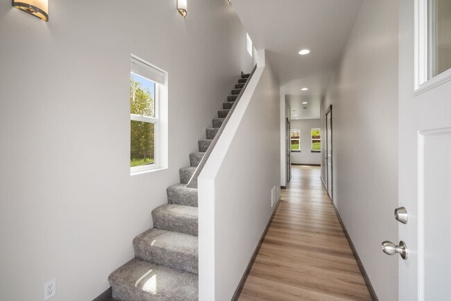 Building Photo - Pet Friendly! Gorgeous 3 Bedroom condo with double stall attached garages with AC.