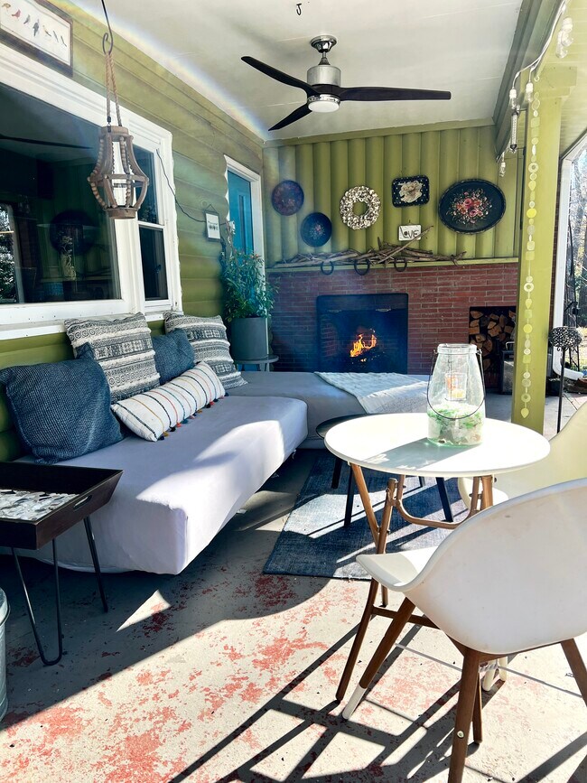 Outdoor seating with fireplace under front porch - 7 Gleason St