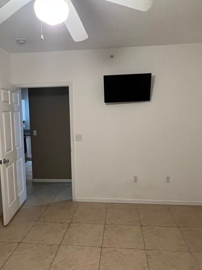 Bedroom with TV - 6832 W Sample Rd