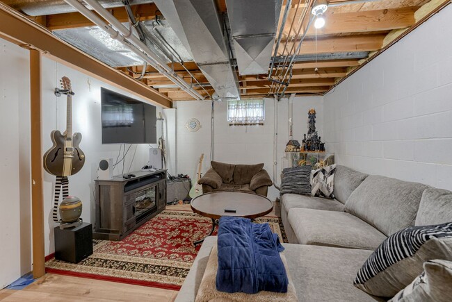 Building Photo - Bright & Airy Tri-Level With Finished Base...