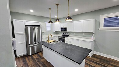 Building Photo - Stunning Renovation Ready for Your Finishing Touches!