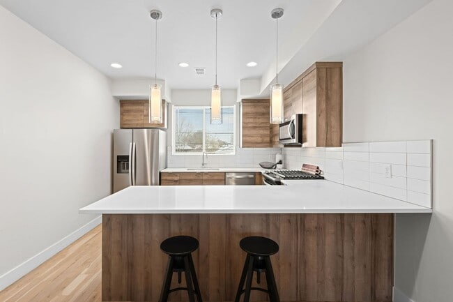 Building Photo - Modern 2-Bedroom Rowhome with Rooftop Moun...