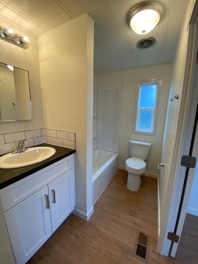 Building Photo - Beautifully just Remodeled-Spacious 3 bedrooms, 2 full baths mobile home with fenced yard. storag...