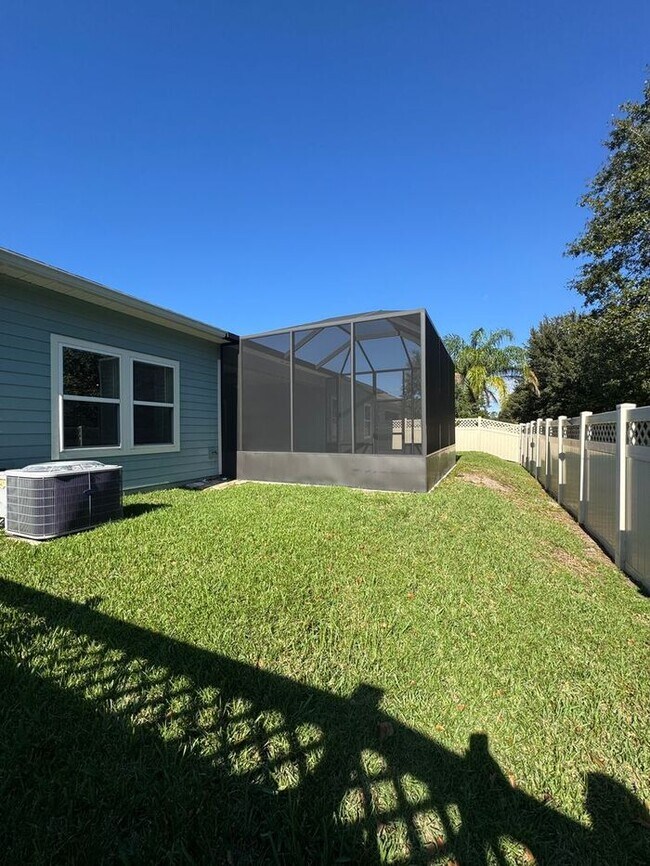 Building Photo - COMING SOON! Beautiful 4BR 3BA Home w/ Screened Lanai & Pond View • Garage Parking • Fenced Yard ...