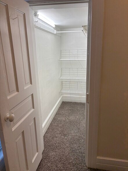 Walk-in closet for small bedroom downstairs. - 319 Garfield Ave