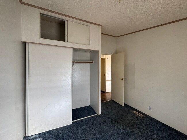 Building Photo - Sunrise Vista -2 Br, 2Ba home with covered carport, fenced yard, storage