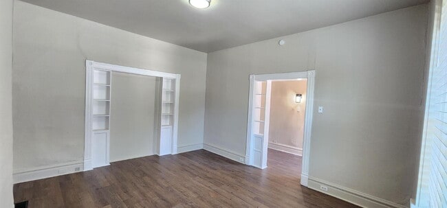 Building Photo - Spacious First-Floor 2BR with Bonus Room & Updated Interior – Pet Friendly!