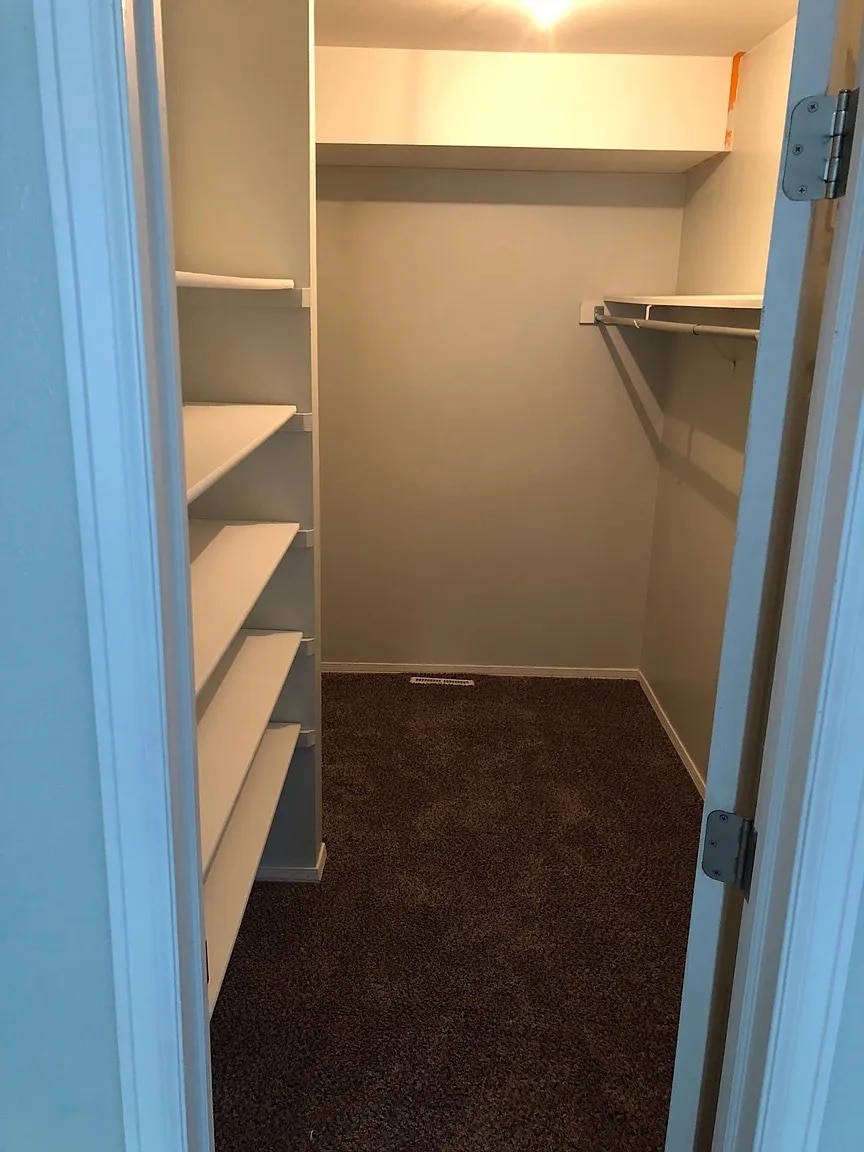 Massive walk-in closet in primary bedroom - 594 Ingalls St