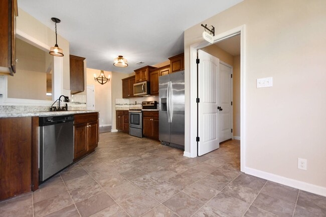 Building Photo - Pet Friendly Three Bedroom with Bonus!