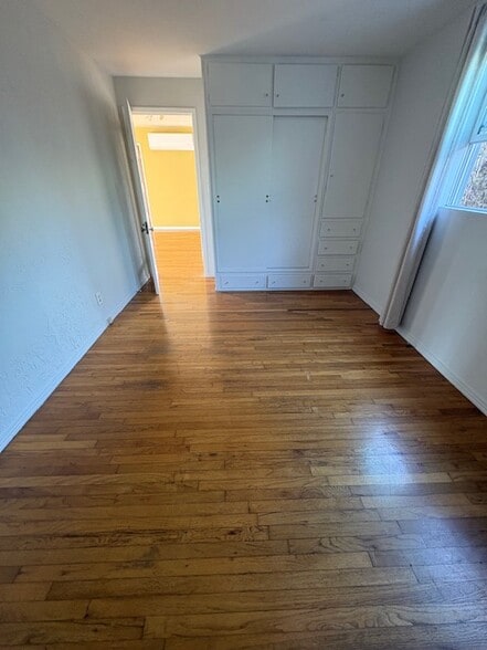 all wood floors in living room, dining area, and bedrooms - 663 Marine St