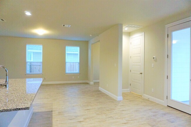 Plenty of room for dining table and bar stools to accommodate entire family and guests - 260 Gaida Loop