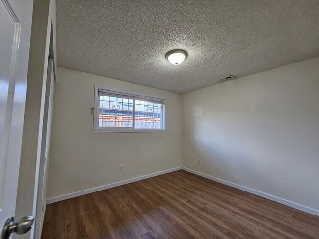 Building Photo - Charming Single-Level Home Featuring New Hardwood Floors, Bright Bedrooms & Open-Concept Living