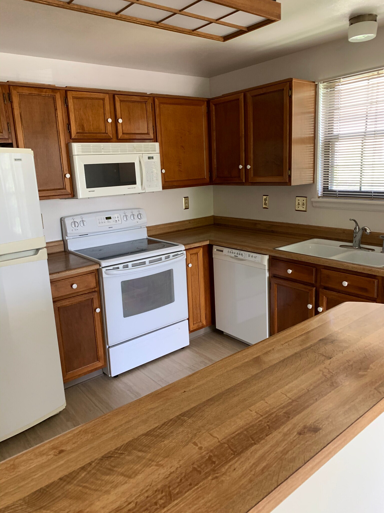 Kitchen with microwave, stove, free, and dishwasher - 5341 76th W Ave