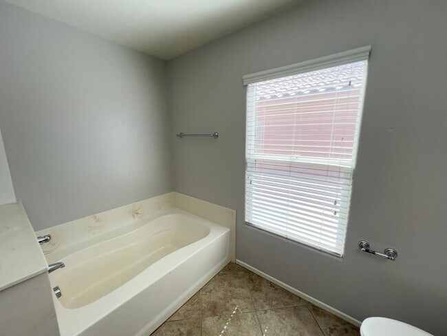 Building Photo - 4 bedroom, 3 bathroom home located in Southwest, NV!