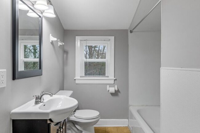 Building Photo - Brick home, Two Story, Hardwoods, DR, 2 Sun Rooms, FP, Carport!.