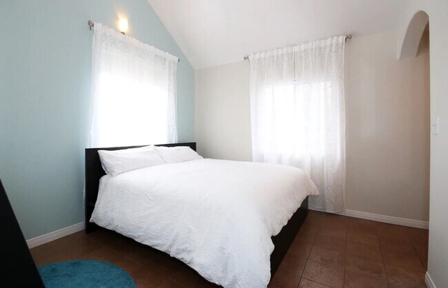 Building Photo - Stunning Duplex with Wrap Around Deck - Available Now