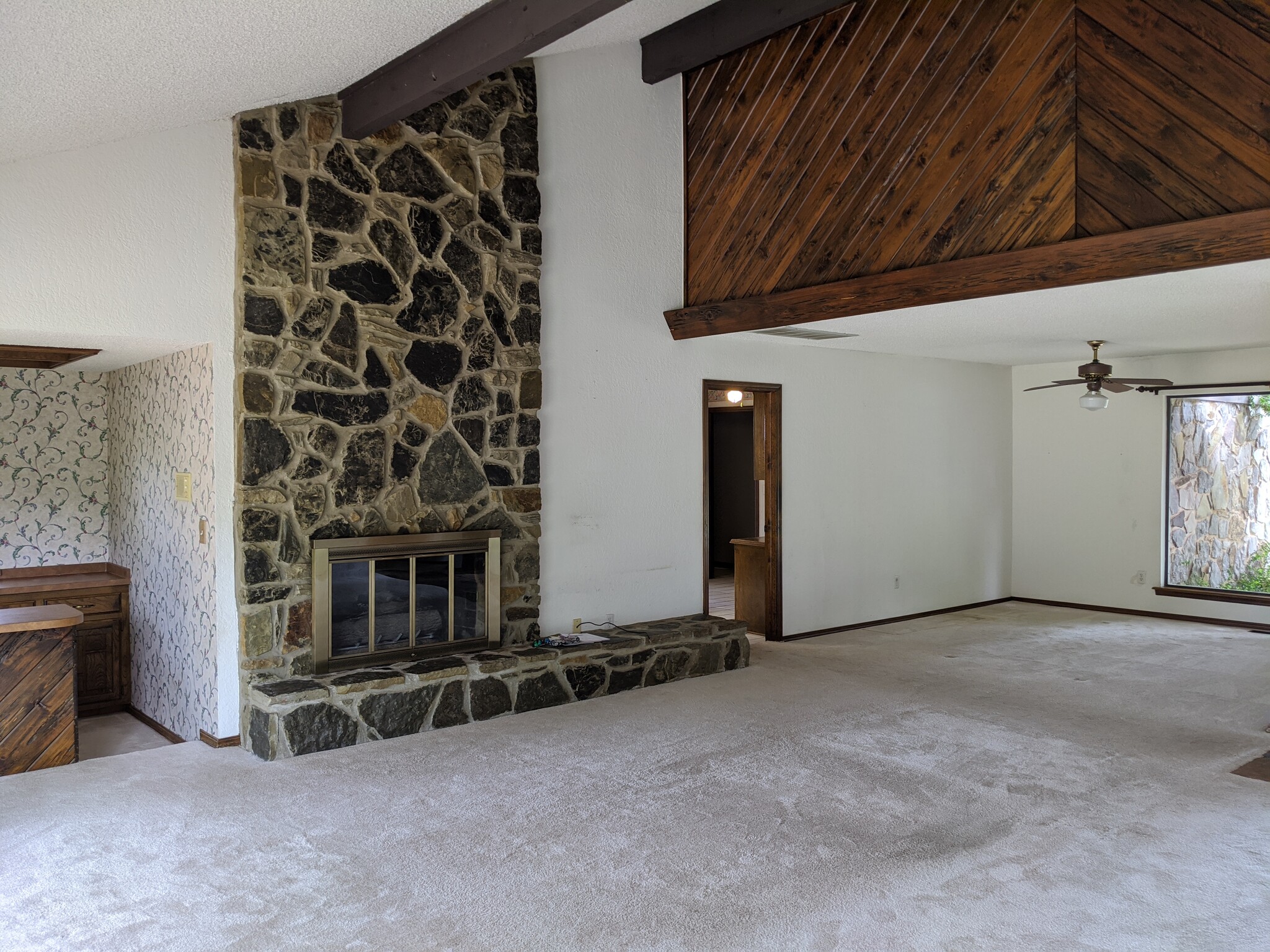 living area looking toward dining area/kitchen - 205 N Easy St