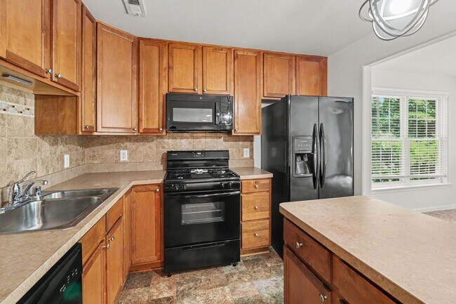 Building Photo - $2,295/Month | 3 Bed | 2.5 Bath | End-Unit Townhome in Belmont at Carmel Church | New HVAC | Wood...