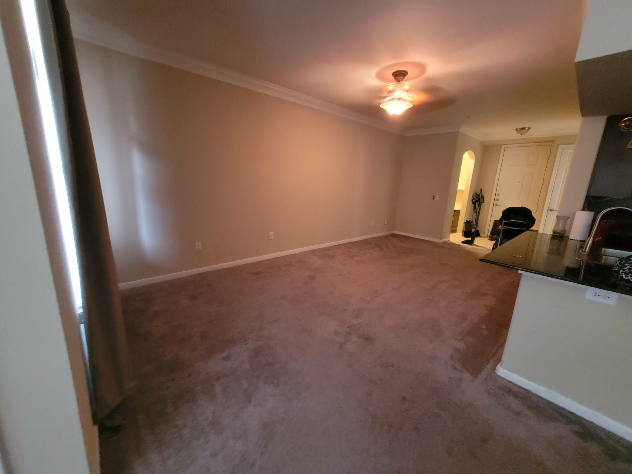 Living room-small office area with shelves is next to the front door - 7575 Kirby Dr