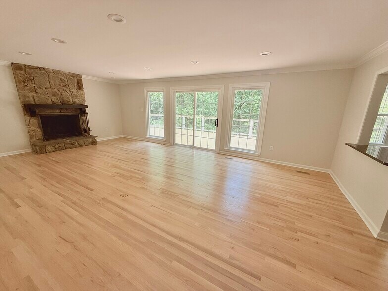 Bright and open main floor living area in center of home with large deck, off open kitchen and dini - 9248 Wood Glade Dr