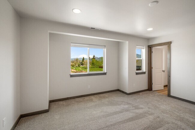 Building Photo - Pet Friendly! Gorgeous 3 Bedroom condo with double stall attached garages with AC.