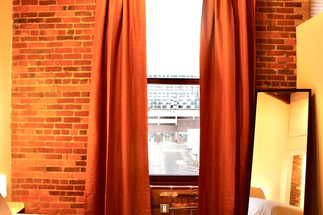 Bedroom window with city view - 150 E Main St