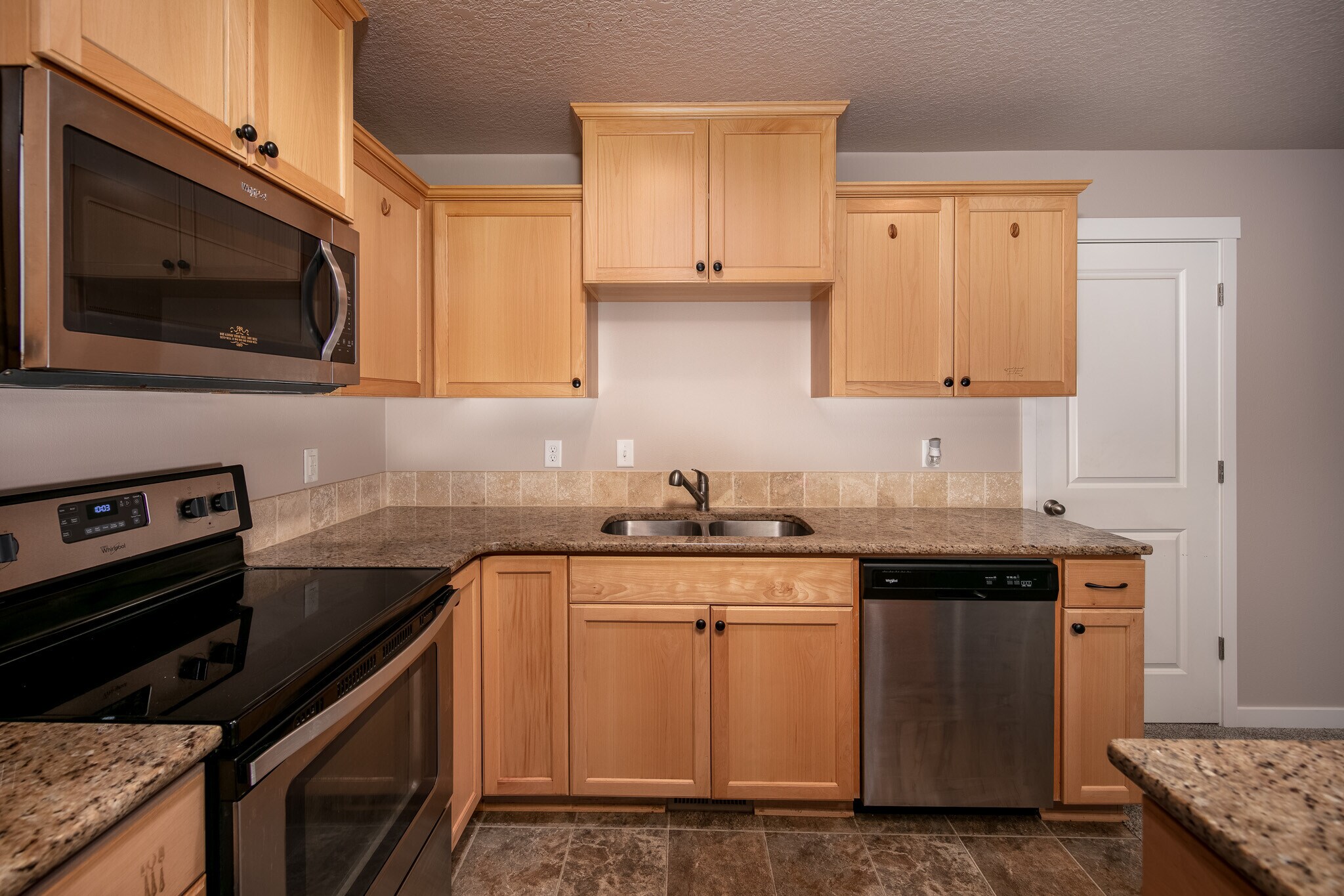 kitchen with closet door - 1295 Windsong Dr