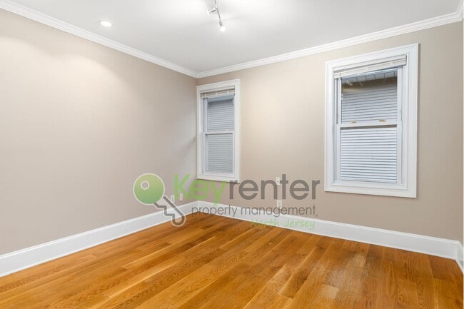 Building Photo - Spacious 3BR Home with Finished Attic, Fenced Yard & Easy NYC Commute – No Broker Fee