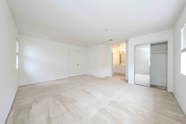 Building Photo - Gated Townhome with Updated Kitchen and Private Backyard