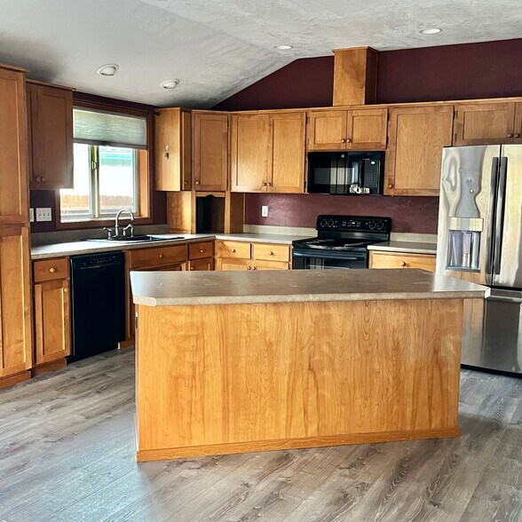 Kitchen open to family and dining room - 107 Applewood Dr