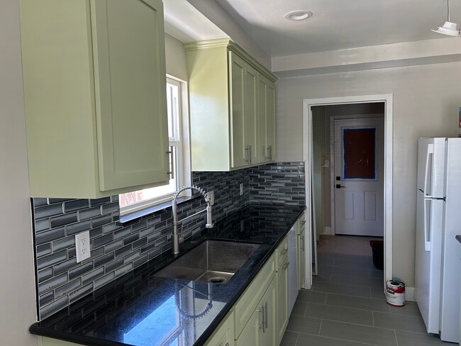 New custom kitchen with new cabinets and hardwood floors - 5303 W Slauson Ave