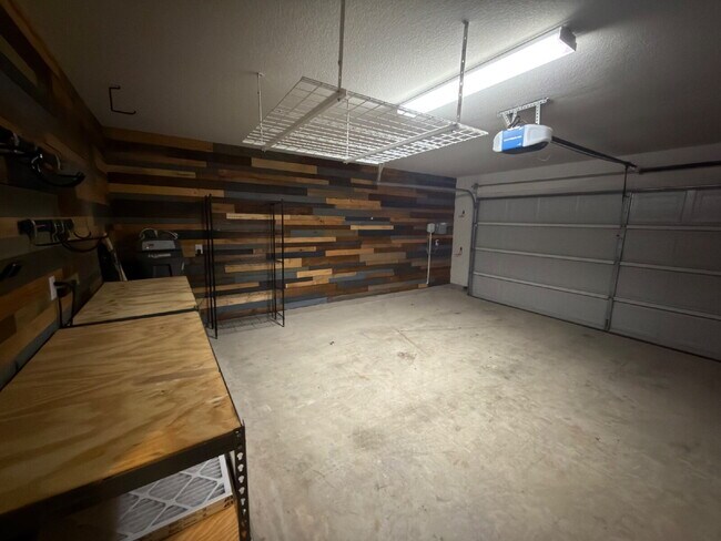 Building Photo - Four bed two bath on a corner lot with a pool in Sunfield. Gas cook top, double ovens. Open kitch...