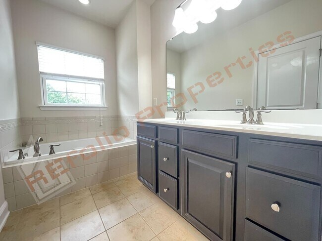 Building Photo - Beautiful 3 Story 3 Bedroom Townhouse with Huge 1st Floor Flex Space with Access to Patio + 2 Car...