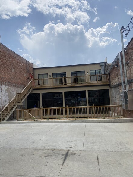 Back (direct) entrance with off-street parking - 307 E Main St