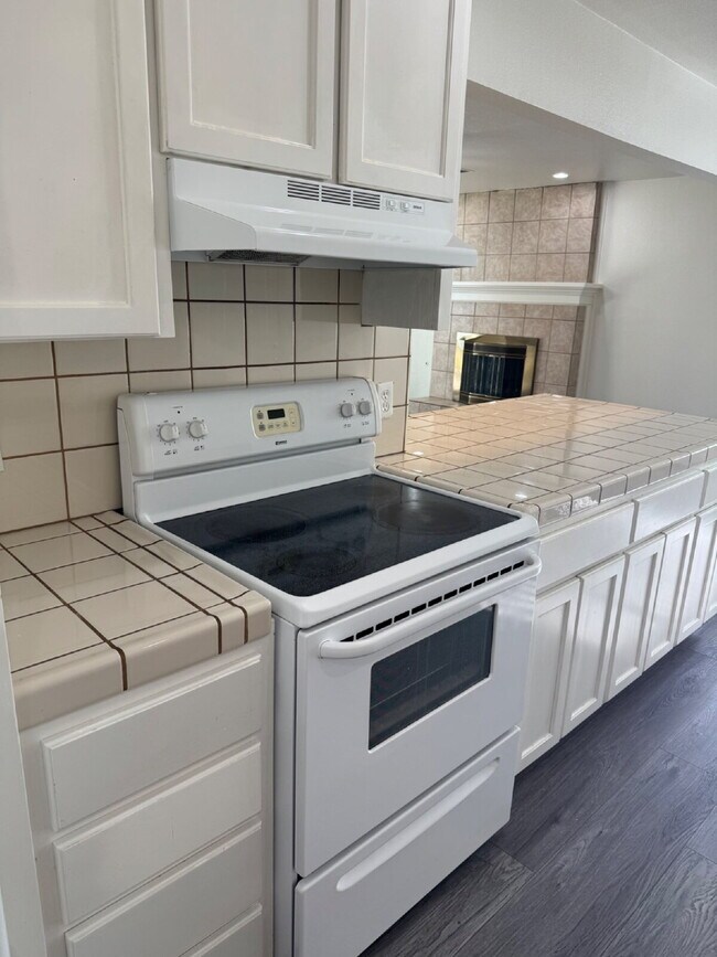 Building Photo - 4-bedroom, 2-bath home with solar, featuring a huge backyard and low-maintenance landscaping with...