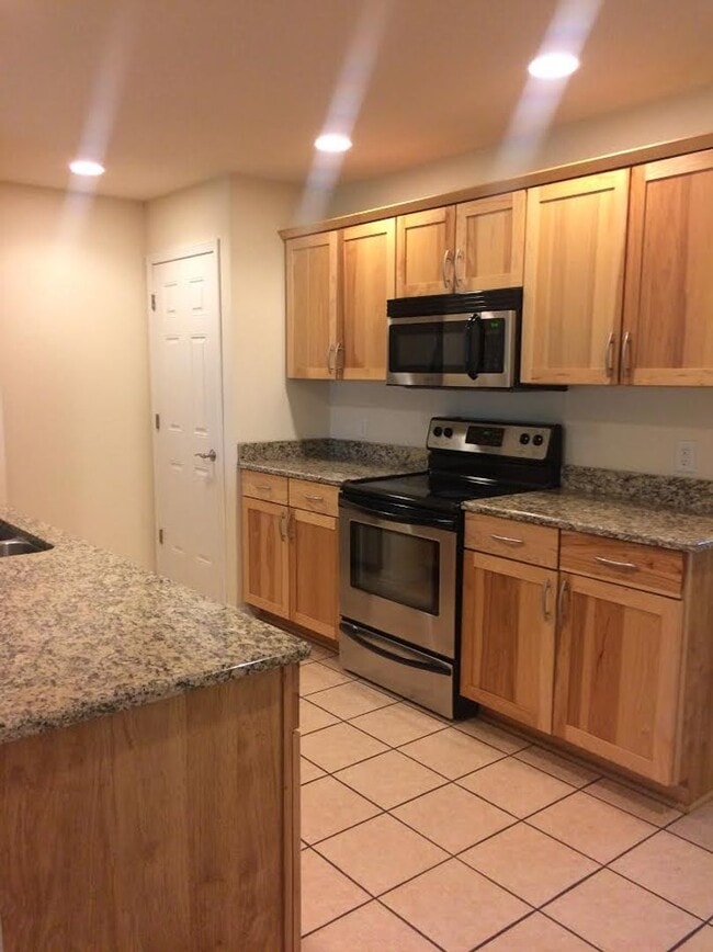 Building Photo - Live Large in This Spacious 2BR Townhome –...