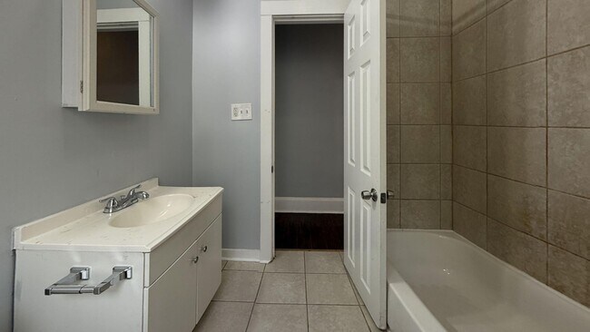 Building Photo - Updated 3 Bedroom 1.5 Bath Townhome w/ Paved Yard + Washer & Dryer