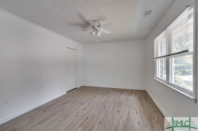 Building Photo - Spacious 2-Bedroom Brick Townhome with Private Fenced Yard