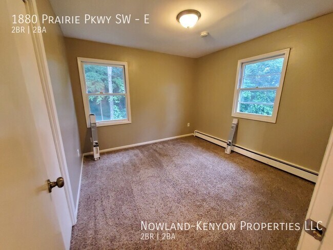 Building Photo - 1880 Prairie Pkwy SW - E- 2 beds, 1 full bath