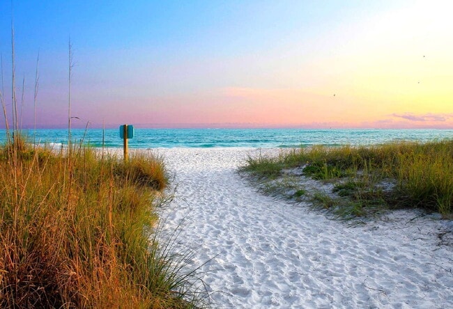 Building Photo - Meticulous Gulf front condo with unobstructed views of the clear blue water.