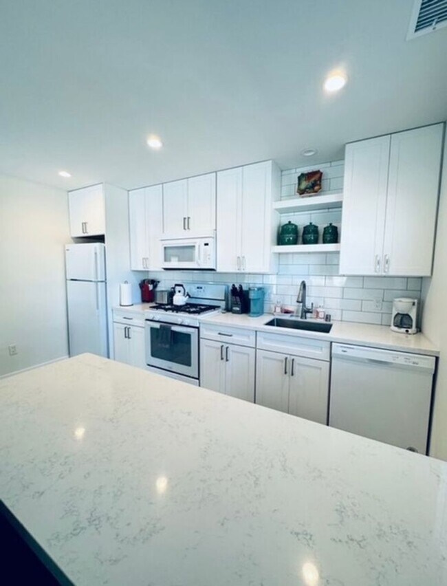 Building Photo - Coastal Luxury Living – Fully Furnished Home with Private Remote Gated Entry!