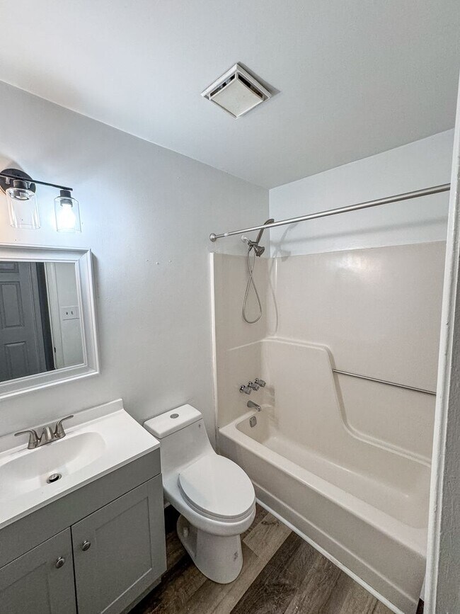 Building Photo - Introducing our spacious townhouse located...