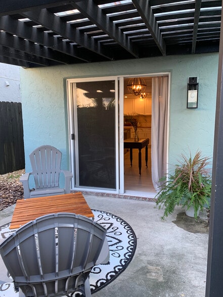 New Hurricaine patio doors leading inside - 1202 N Andrews Ave
