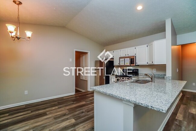 Building Photo - REDUCED- Now offering $1000 off first full...