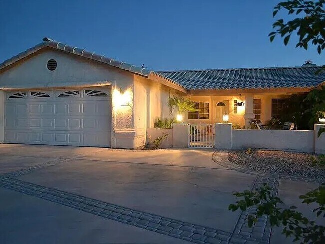 exterior and front yard at night - 3640 Vega Dr