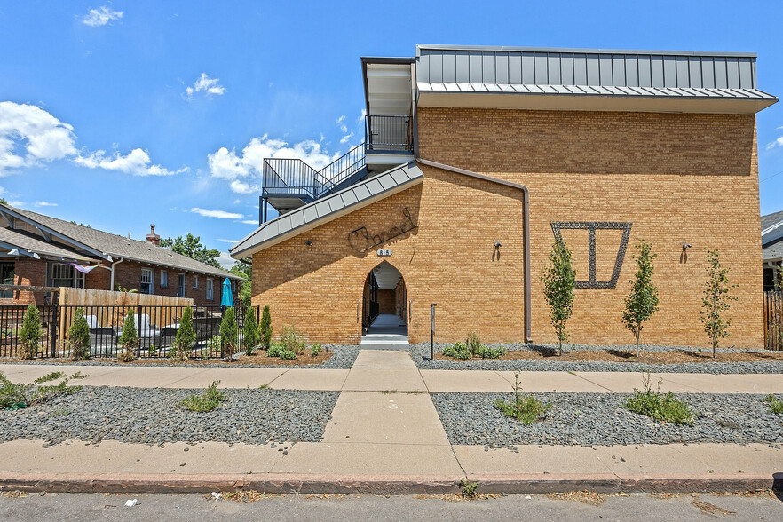 Experience the welcoming charm of this beautifully designed brick apartment exterior. - Charmel Apartments