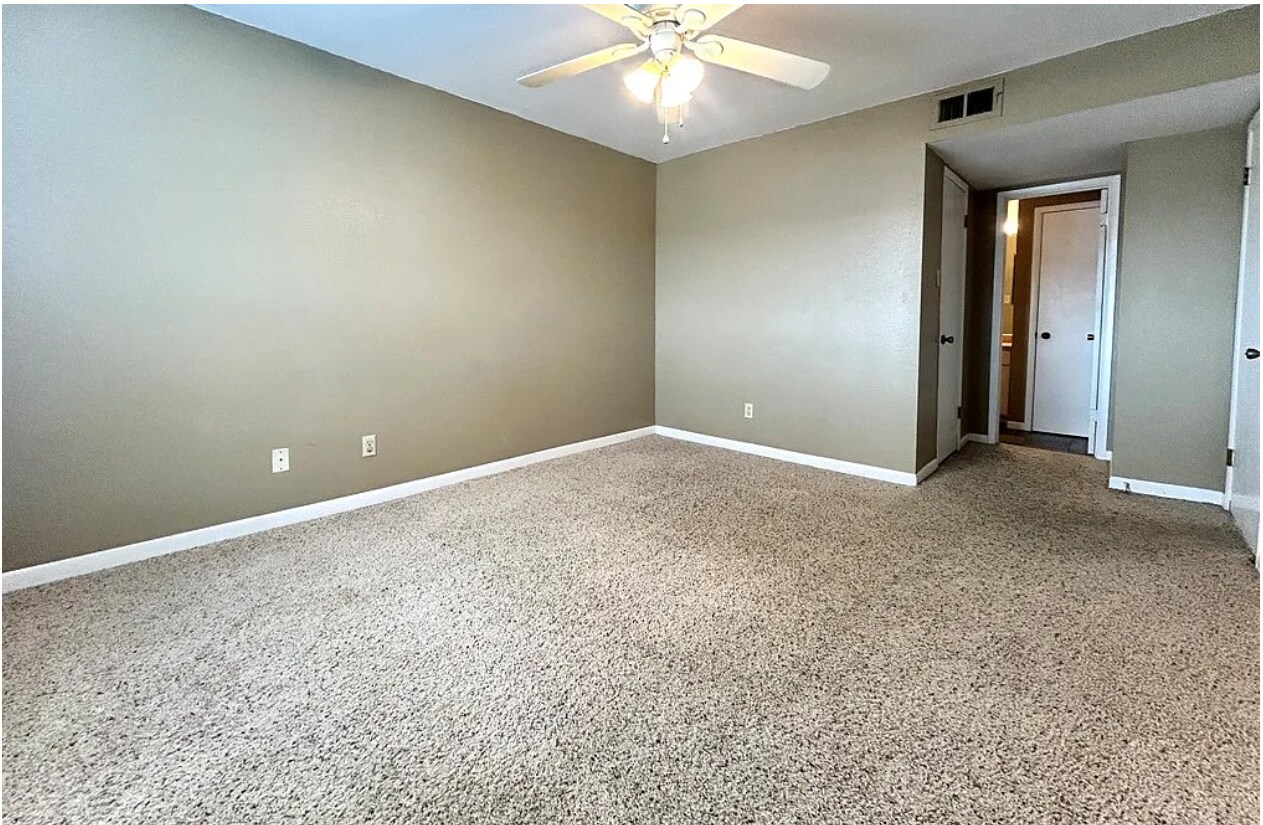 Bedroom #2 w/ Large Window and carpet - 904 University Oaks Blvd