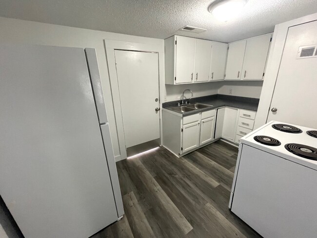 Building Photo - "Charming 2-Bedroom Wichita Home with Gleaming Hardwood Floors!"