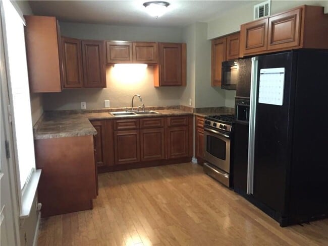 Building Photo - Remodeled 1 story home in Hurst with original plank wood flooring